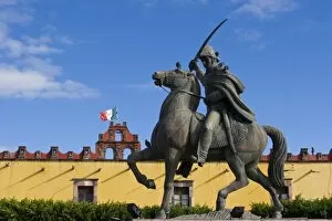 Mexico, San Miguel de Allende. Statue of General Ignacio Allende, and Mexican flag
