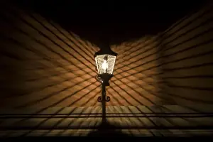 Images Dated 3rd November 2006: Mexico, San Miguel de Allende. Wire cage lamp at night creates shadow pattern on wall