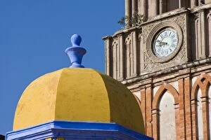 Mexico, San Miguel de Allende. Yellow dome of Church of San Rafael with clock