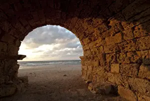 Aqueduct Prints: Middle East, Israel, remains of an ancient aqueduct as sunset at the historic city