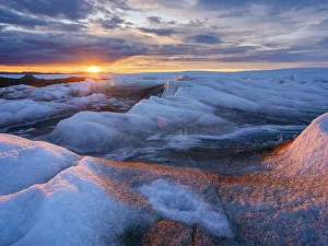 North Greenland Prints: Midnight sun on the ice sheet. The brown sediment on the ice is created by the rapid melting of the ice