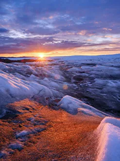 North Greenland Prints: Midnight sun on the ice sheet. The brown sediment on the ice is created by the rapid melting of the ice