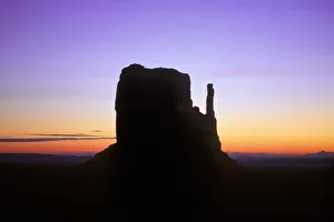Prints of Mitten Butte silhouetted against dawn sky, Monument Valley Navajo Tribal Park, Arizona, USA Images Dated 2018 December: Mitten Butte silhouetted against dawn sky