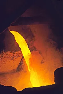 Molten metal being poured in foundry