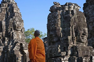 Monk Prints: Monk with huge smiling face at Bayon Temple, Angkor Thom, UNESCO World Heritage site