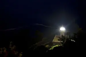 Faro Prints: Monte Igueldo Lighthouse at night in La Concha Bay near the city of Donostia-San Sebastian