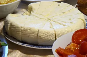 Gastronome Prints: Montenegrin food speciality: fresh sheep cheese cut in triangles on a plate
