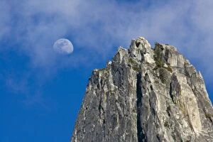 Images Dated 28th March 2007: The moon rises and shines through the clouds above Cathedral Rock - Yosemite National Park