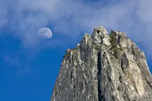 Celestial Prints: The moon rises and shines through the clouds above Cathedral Rock - Yosemite National Park