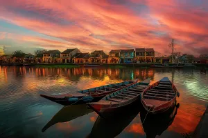 Images Dated 16th July 2024: Moored boats in lake and village buildings. (AI Generated)