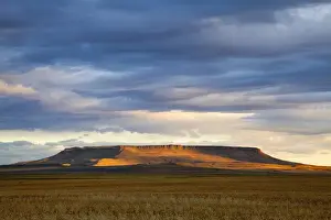 Great Falls Prints: Morning sunlight breaks through the cloud cover and illuminates Square Butte near Great Falls