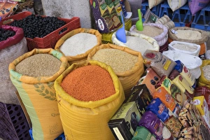 Moroccan Prints: Morocco, Casablanca. Bags of lentils, rice and other dry goods at a shop in the medina