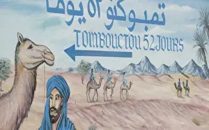 Images Dated 16th March 2006: MOROCCO, Draa Valley, ZAGORA: Famous sign of Timbouctou 52 jours camel caravans