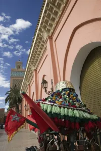 Marrakech Prints: MOROCCO, MARRAKECH: Kasbah Mosque (Kasbah=Royal Quarter) Exterior and waterboy hat