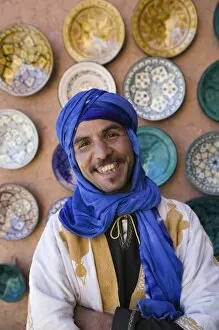 Images Dated 14th March 2006: MOROCCO, South of the High Atlas, OUARZAZATE: Young Merchant in Blue Headress / Ensemble Artisanat