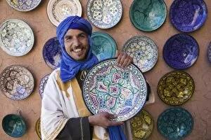 Images Dated 14th March 2006: MOROCCO, South of the High Atlas, OUARZAZATE: Young Merchant in Blue Headress / Ensemble Artisanat