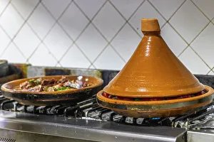 Souss Massa Prints: Morocco, Taroudant Province. Hotel Dar Zitoune, cooking food in a tagine