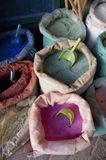 Morocco, Tetouan. Historic medina bazaar. Colorful powdered dye in sacks