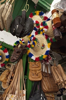 Images Dated 1st June 2010: Morocco, Tetouan. Historic medina bazaar. Typical leather & souvenir shop with traditional