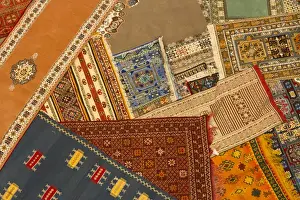 Carpet Prints: Morocco, Tinerhir. Colorful handmade Berber carpets are displayed for sale in a shop