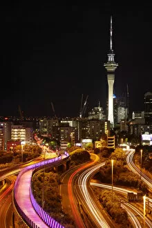 Motorways, Lightpath cycleway, and Skytower at night, Auckland, North Island, New Zealand