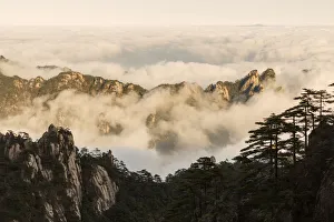 Mountain peaks and mist from above at sunrise, Yellow Mountain or Huangshan