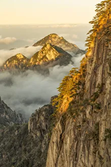 Mountain peaks and mist from above at sunrise, Yellow Mountain or Huangshan