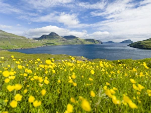 The mountains and cliffs of Streymoy with the Vestmannasund. The island Streymoy