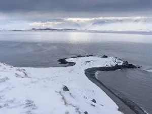 Murky Prints: Mountains in the Eyjafoerdur region during winter in nothern Iceland