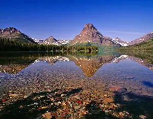 Medicine Prints: Mountains reflect into calm Two Medicine Lake in Glacier National Park in Montana
