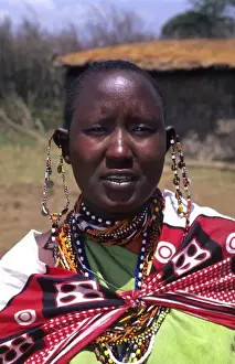 Masaai Prints: Msai tribe dark woman in costume traditional dress in jungles near Kenya Africa (MR)