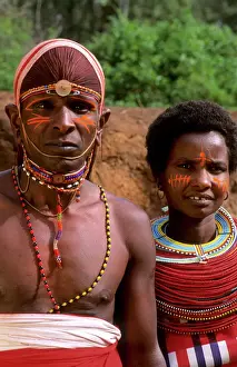Woman Prints: Msai tribe people couple in costume traditional dress in jungles near hut near Kenya Africa