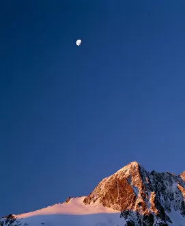 Mt. Crosscut and a rising moon in the evening light, Fjordland Nat l Park on the South Island