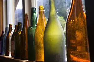 Bottle Prints: Museum interior with historical tools from the working camp in Hollyford Valley