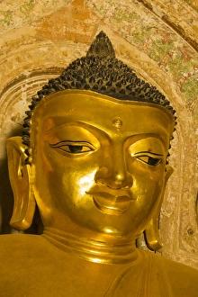 Images Dated 23rd November 2014: Myanmar. Bagan. Htilominlo Temple. Golden Buddha
