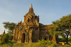 Bagan Prints: Myanmar. Bagan. Red brick temple glows in the late afternoon light