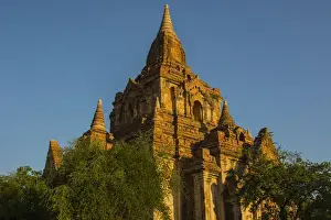 Images Dated 24th November 2014: Myanmar. Bagan. Red brick temple glows in the late afternoon light