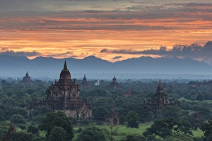 Images Dated 24th October 2013: Myanmar, Bagan. Sunrise over stupas on the plains of Bagan
