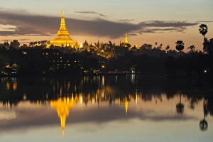 Myanmar, Yangon. Dusk falls on Schwedagon Pagoda