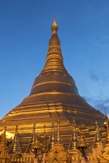 Golden Prints: Myanmar, Yangon. A golden stupa at Shwedagon Pagodo, at twilight