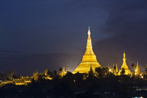 Images Dated 2nd November 2013: Myanmar, Yangon. Schwedagon Pagoda glows at twilight
