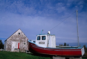 Blue Rock Prints: N. A. Canada, Nova Scotia, Blue Rocks. Lobster boat on dry land