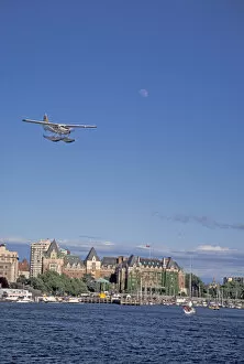 NA, Canada, BC, Victoria Harbor, Harbor Air float plane makes final approach