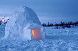 NA, Canada, Manitoba, Churchill. Arctic igloo with candle light inside