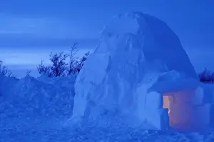NA, Canada, Manitoba, Churchill Arctic igloo with candle light inside