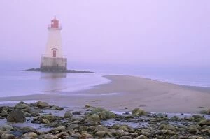 N.A. Canada, Nova Scotia, Shelburne County. Sandy Point lighthouse on a foggy morning