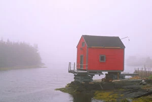 N.A. Canada, Nova Scotia, Stonehurst. Red fishing shed in fog