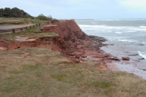 NA, Canada, Prince Edward Island. Sea cliffs near East Point lighthouse where the tides of the St