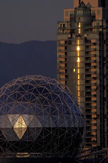 N.A. Canada, Vancouver, B.C. Science World Dome and building, lit by setting sun