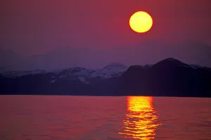 NA, USA, Alaska, Prince William Sound Sunset over the sound and the Chugach Mountains